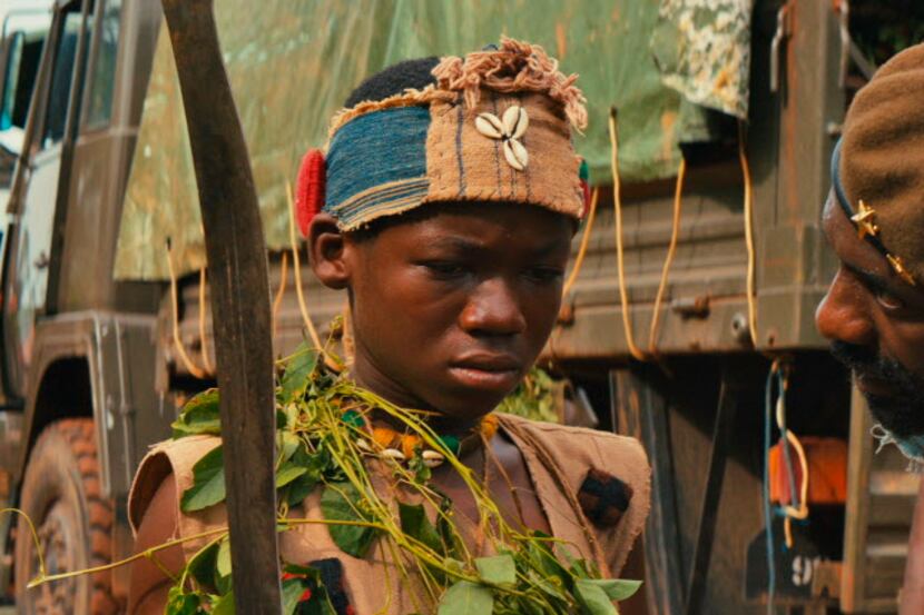 Abraham Attah, and Idris Elba are standouts in Beasts of No Nation.  (Netflix via AP)