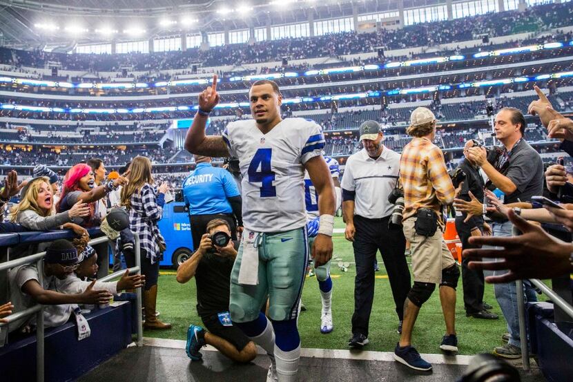 Dallas Cowboys quarterback Dak Prescott (4) leaves the field after a 27-17 win over the...