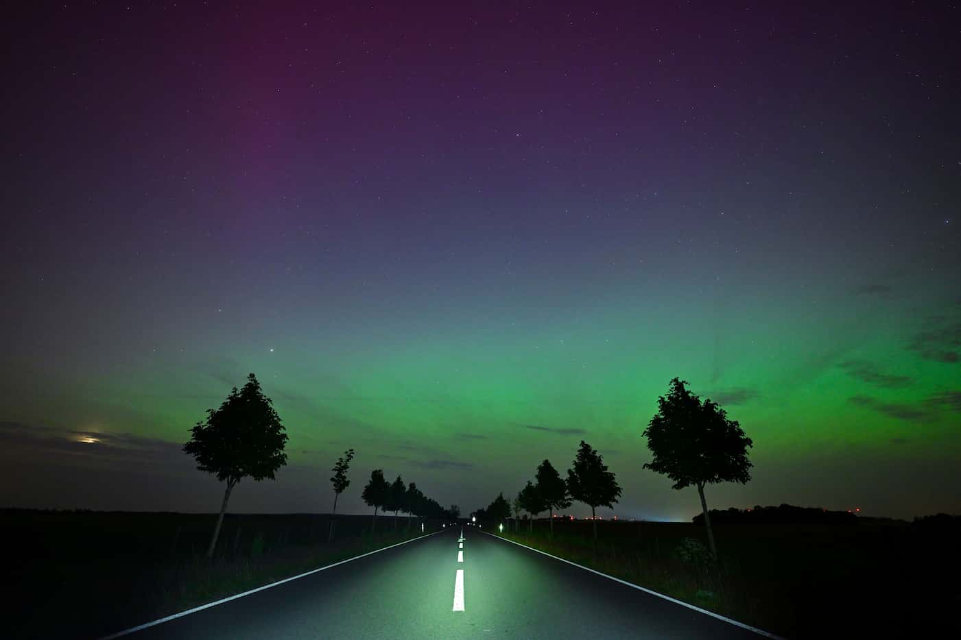 The Northern Lights appear in the night sky over East Brandenburg, Friday, May 10, 2024....