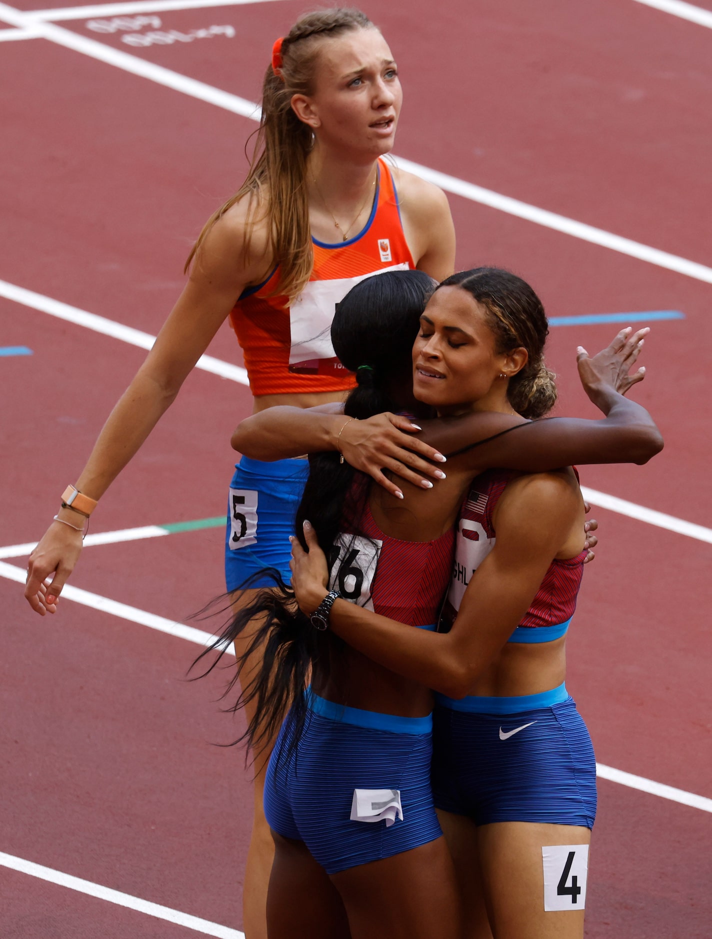 USA’s Sydney McLaughlin hugs USA’s Dalilah Muhammad after they finished first and second in...