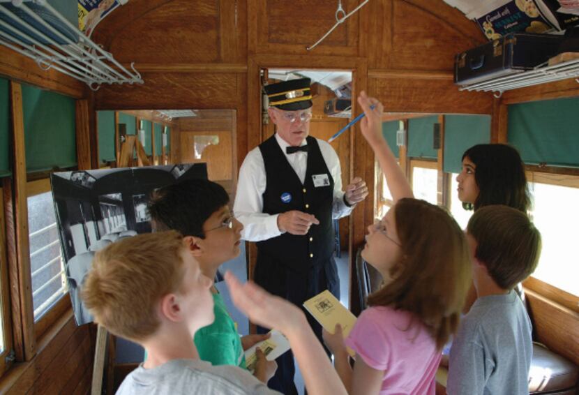 __ Caption: Costumed motormen lead guests through a tour of the museum and Rail Car #360 at...