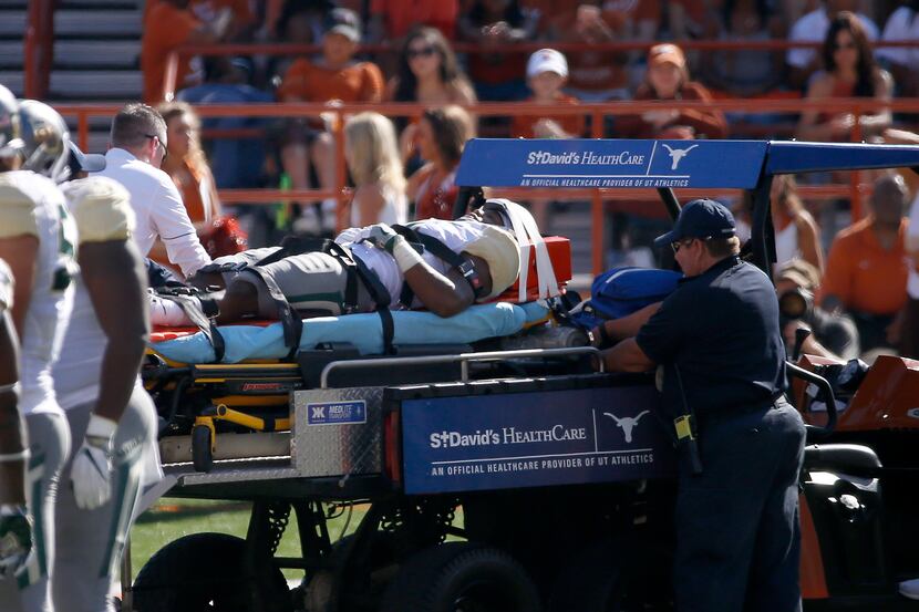 Baylor cornerback Grayland Arnold is carted off the field during the first quarter against...