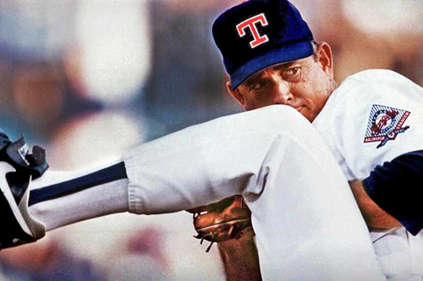  July 19, 1993--Texas Rangers pitcher Nolan Ryan winds up to throw a pitch against the...