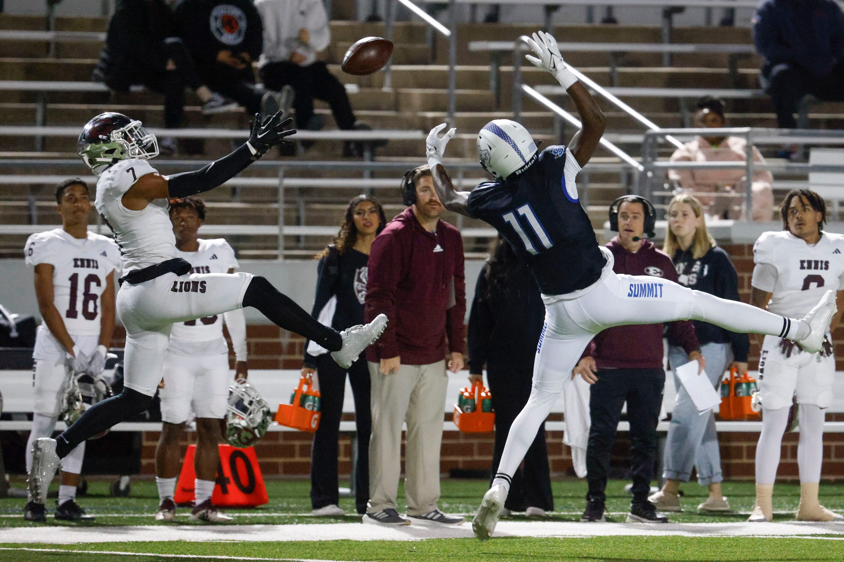 Ennis High’s Wondame Davis Jr. (left) intercepts a pass intended for Mansfield Summit High’s...