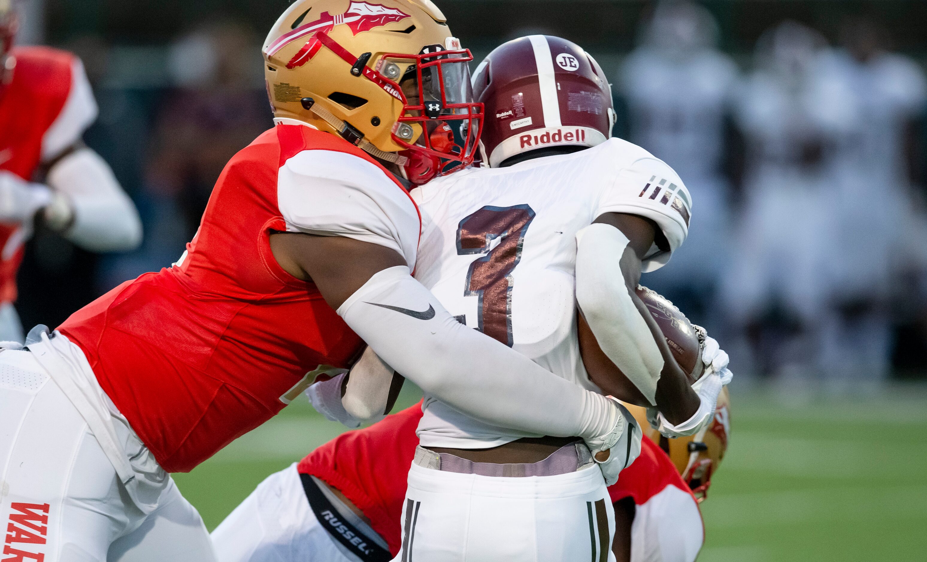 South Grand Prairie senior linebacker Marsel McDuffie (2), rights tackles Mesquite junior...