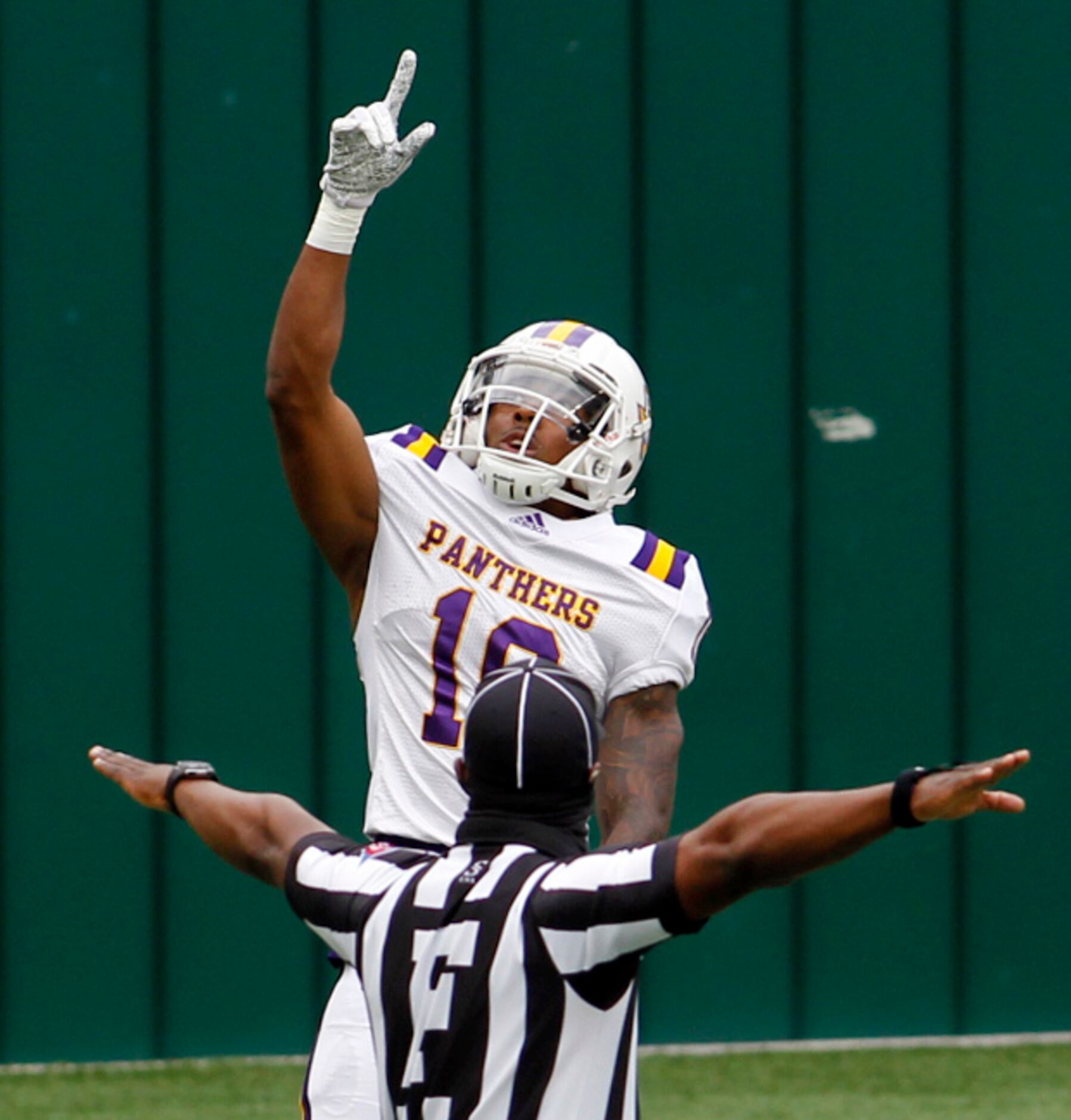 Prairie View A&M receiver Christopher Simmons (18) points upward as he celebrates a leaping...