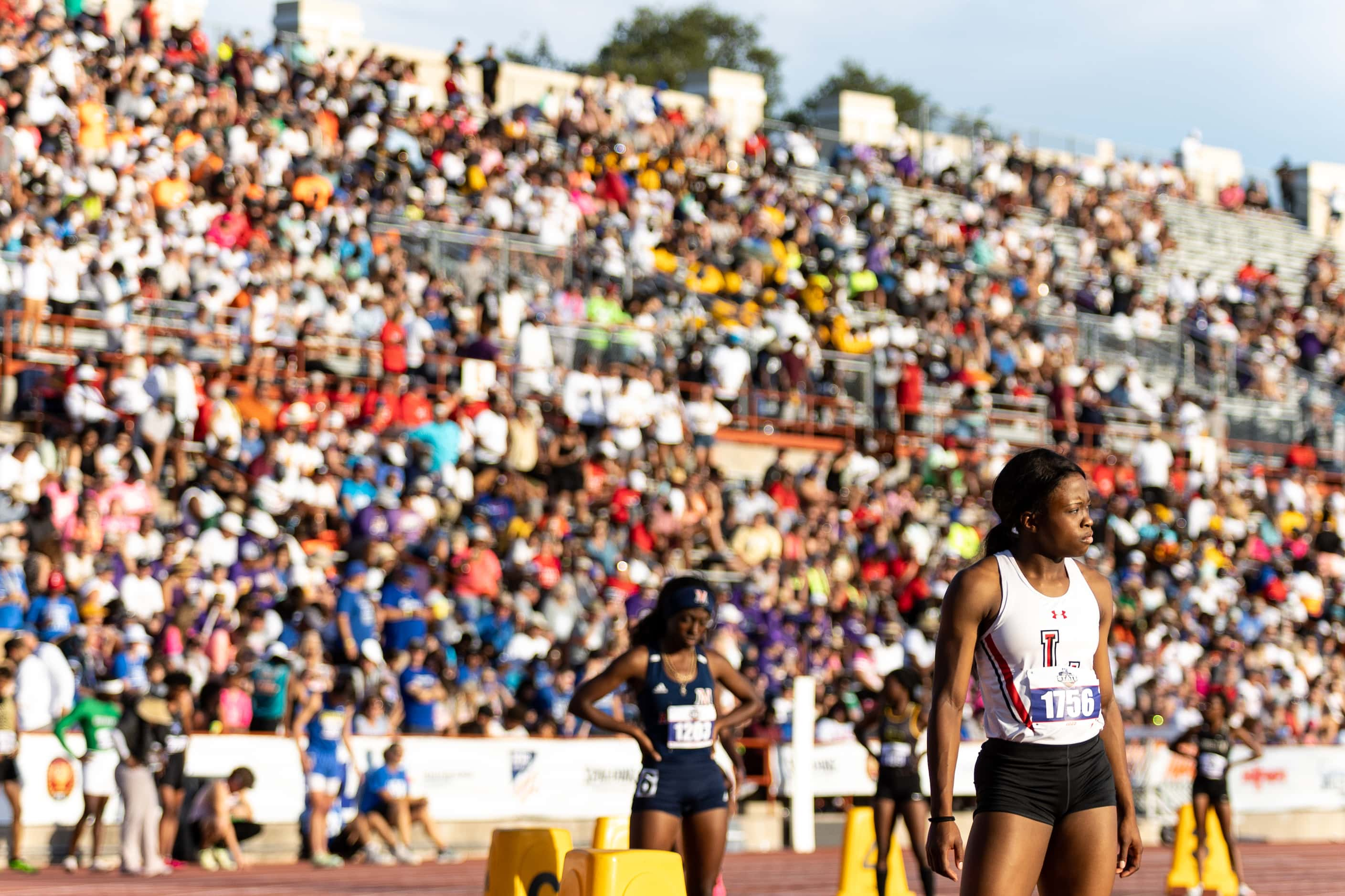 Christine Mallard of Mansfield Legacy prepares at the start for the girls’ 400m dash at the...