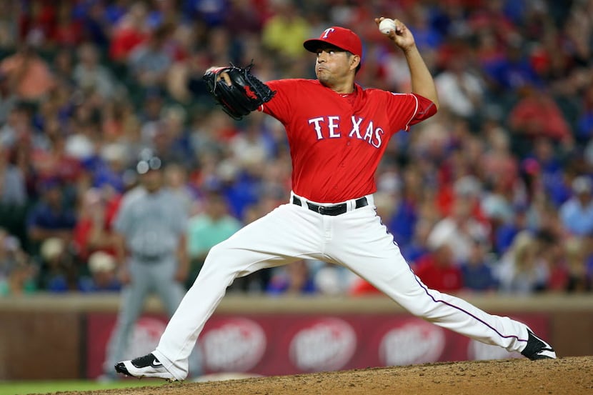 ARLINGTON, TX - JUNE 04: Cesar Ramos #55 of the Texas Rangers throws in the eighth inning...