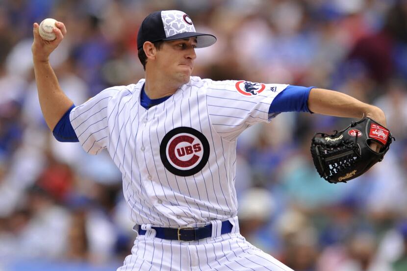 Chicago Cubs starter Kyle Hendricks delivers a pitch during the first inning of a baseball...