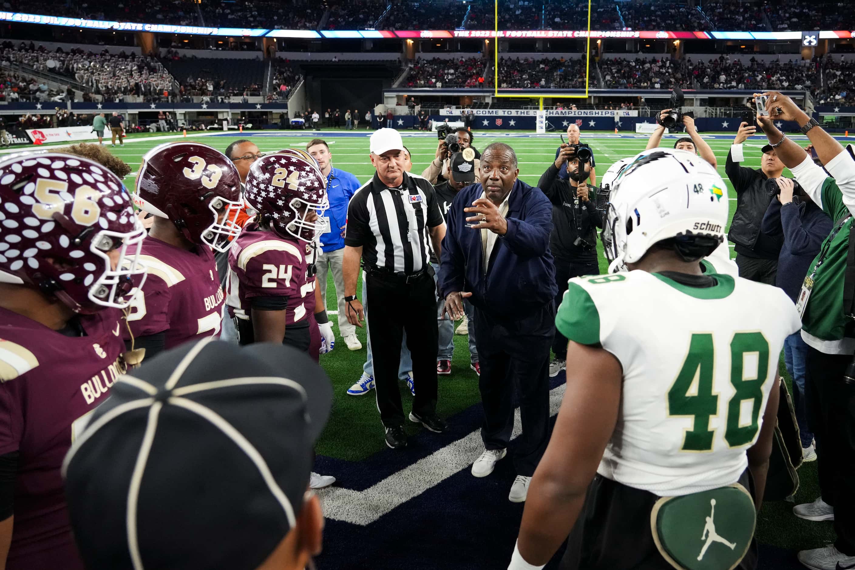 Texas Sen. Royce West preforms the pregame coin toss before the Class 6A Division II state...