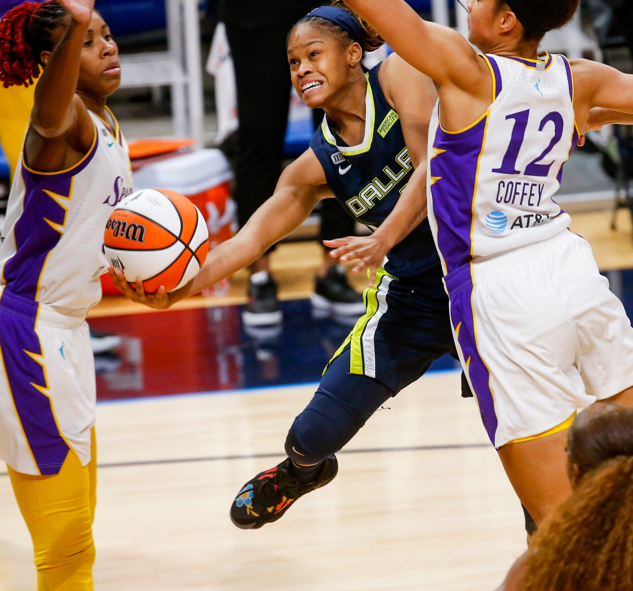 Dallas Wings guard Moriah Jefferson (4) is blocked by the Los Angeles Sparks defense in the...