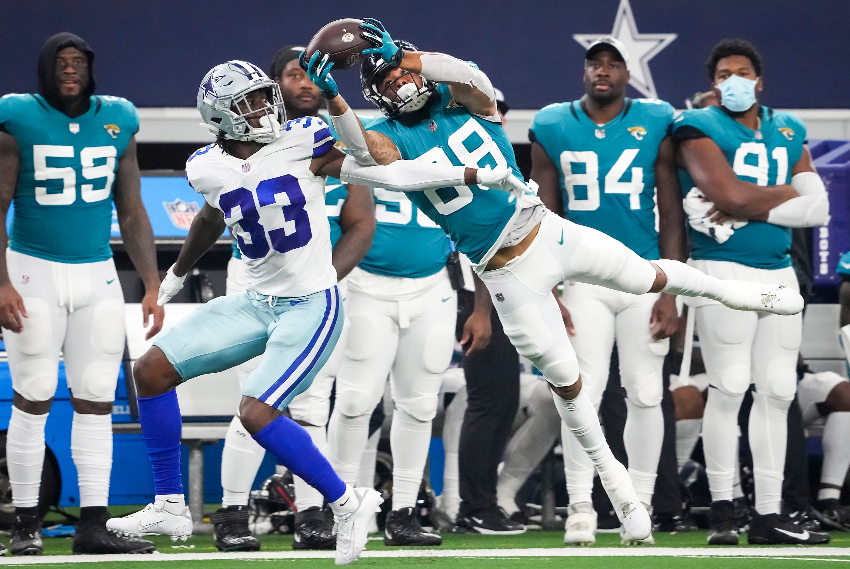 Jacksonville Jaguars wide receiver Jeff Cotton, Jr., (88) hauls in a long pass as Dallas...