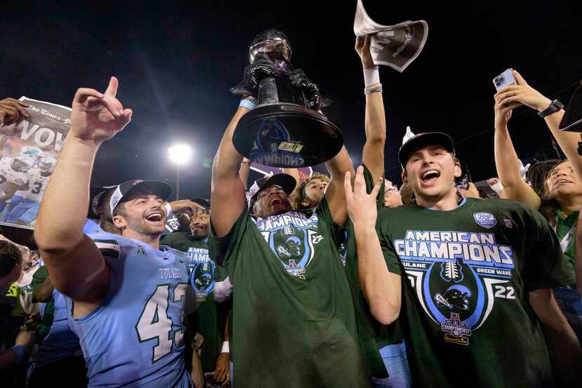Tulane safety Macon Clark, center, celebrates the team's victory against Central Florida at...