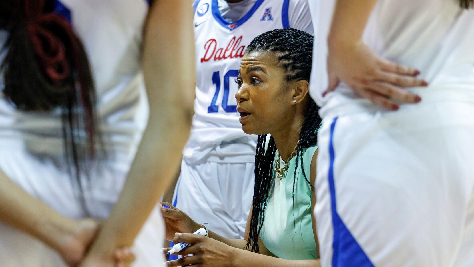 SMU head coach Toyelle Wilson talks with the team during a timeout in the third quarter of a...