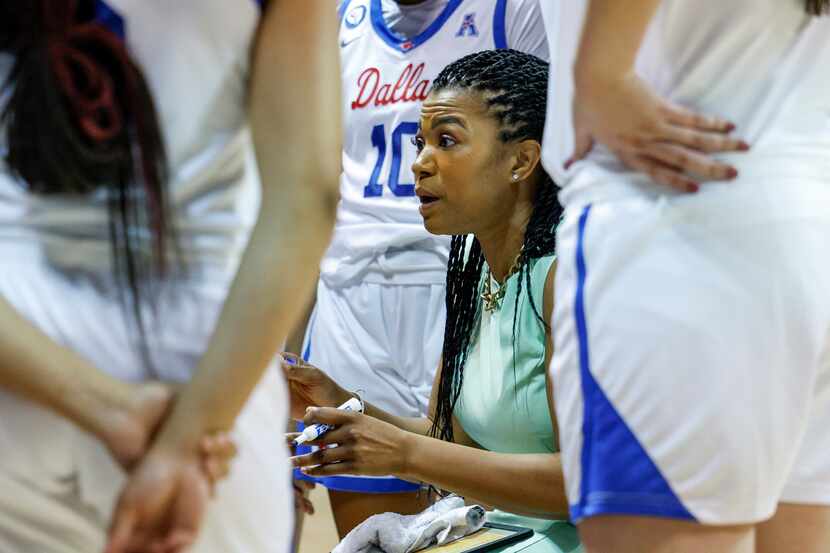 SMU head coach Toyelle Wilson talks with the team during a timeout in the third quarter of a...