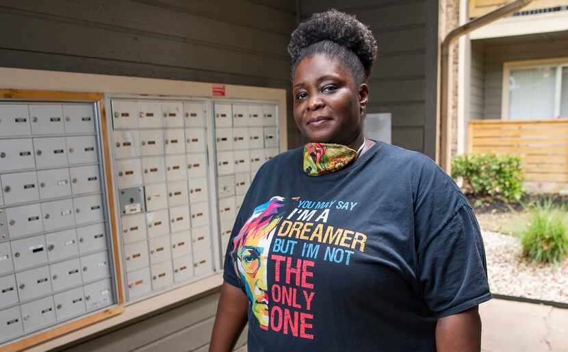 Katina Range, who has worked as a postal clerk since 1992, poses for a photo in the mail...