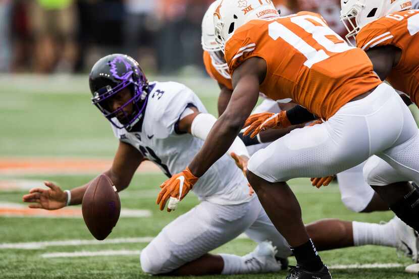 The ball comes loose after TCU Horned Frogs quarterback Shawn Robinson (3) was tackled...