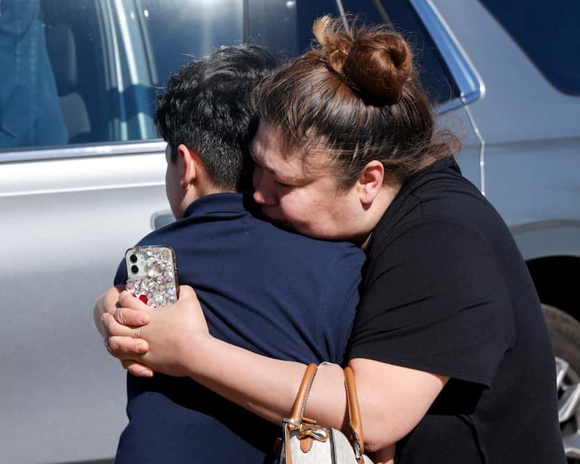 Connie Garcia hugs her son Michael Garcia, 13, after being reunited at Living Truth Baptist...