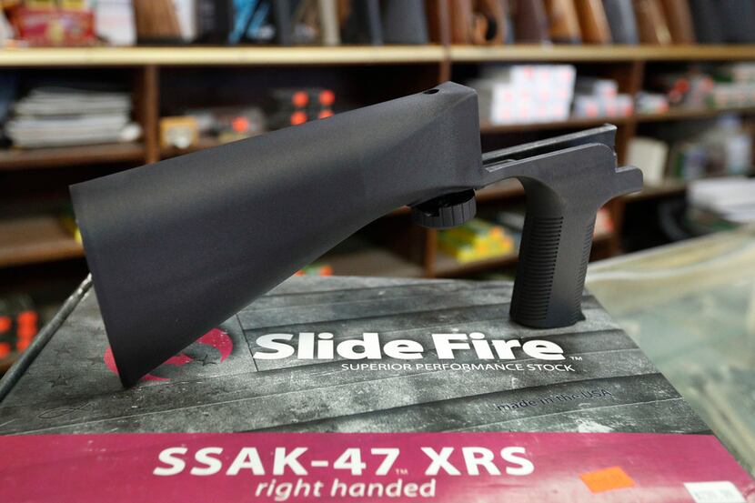A bump stock device, made by Slide Fire, fits on a semiautomatic rifle to increase the...