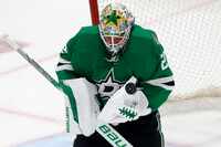 Dallas Stars goaltender Jake Oettinger (29) makes a save against Colorado Avalanche during...