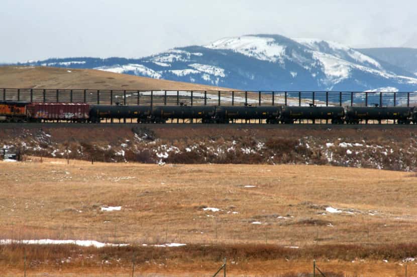 FIILE - In this Nov. 7, 2013, file photo, a train hauls oil into Glacier National Park near...