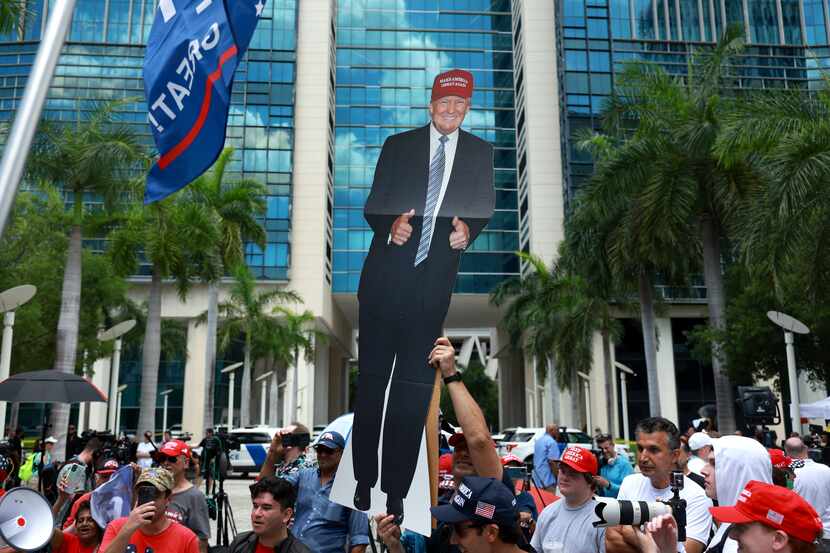 Supporter Joe Compono held a cutout of former President Donald Trump outside the Wilkie D....