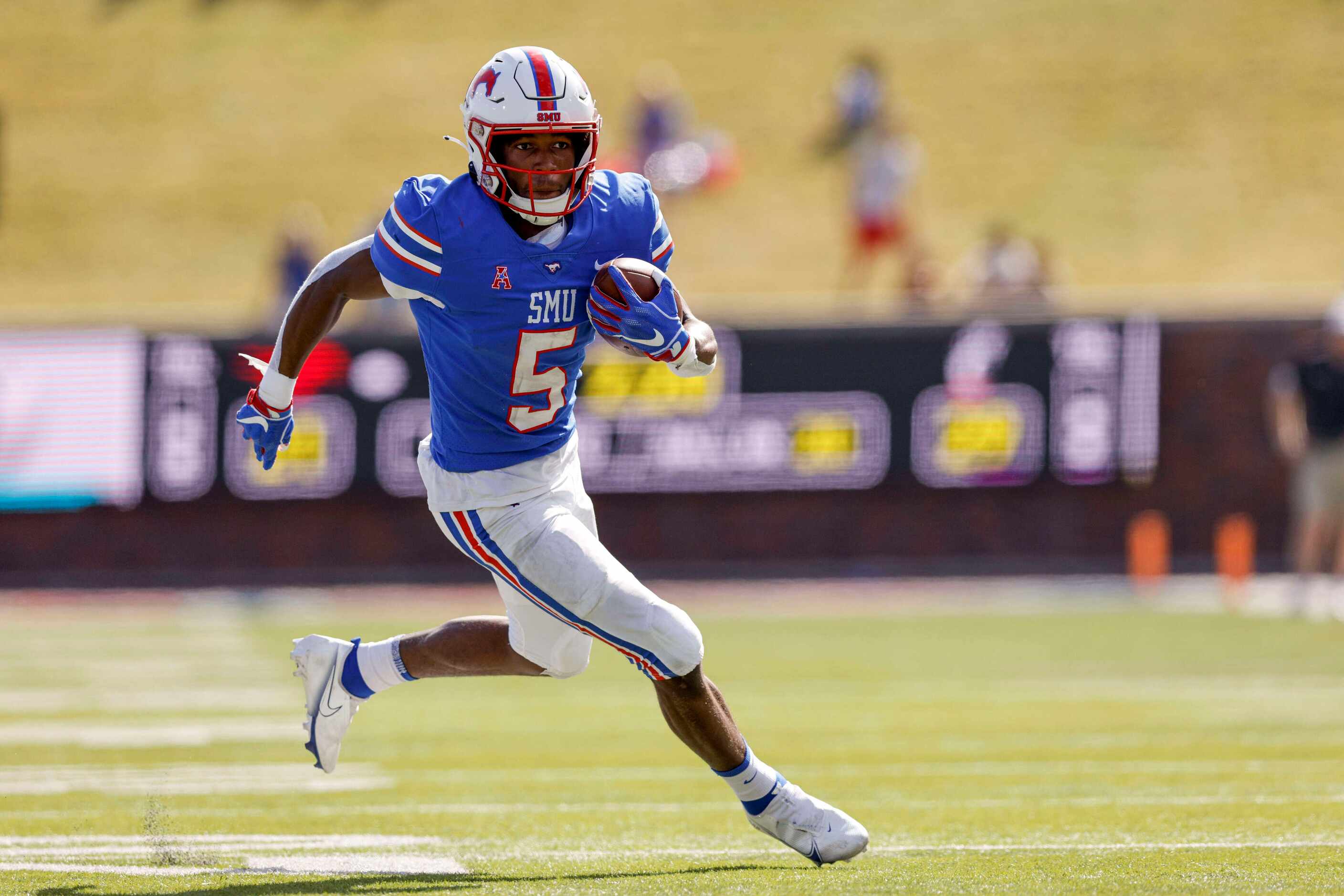 SMU wide receiver Moochie Dixon (5) runs after a catch during the second half of an NCAA...