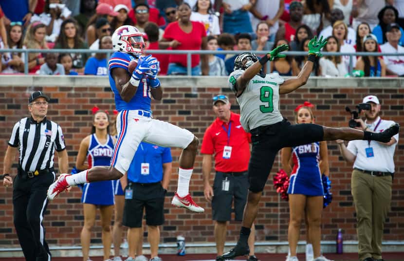 FILE - SMU wide receiver Courtland Sutton (16) catches a pass over UNT defensive back Nate...