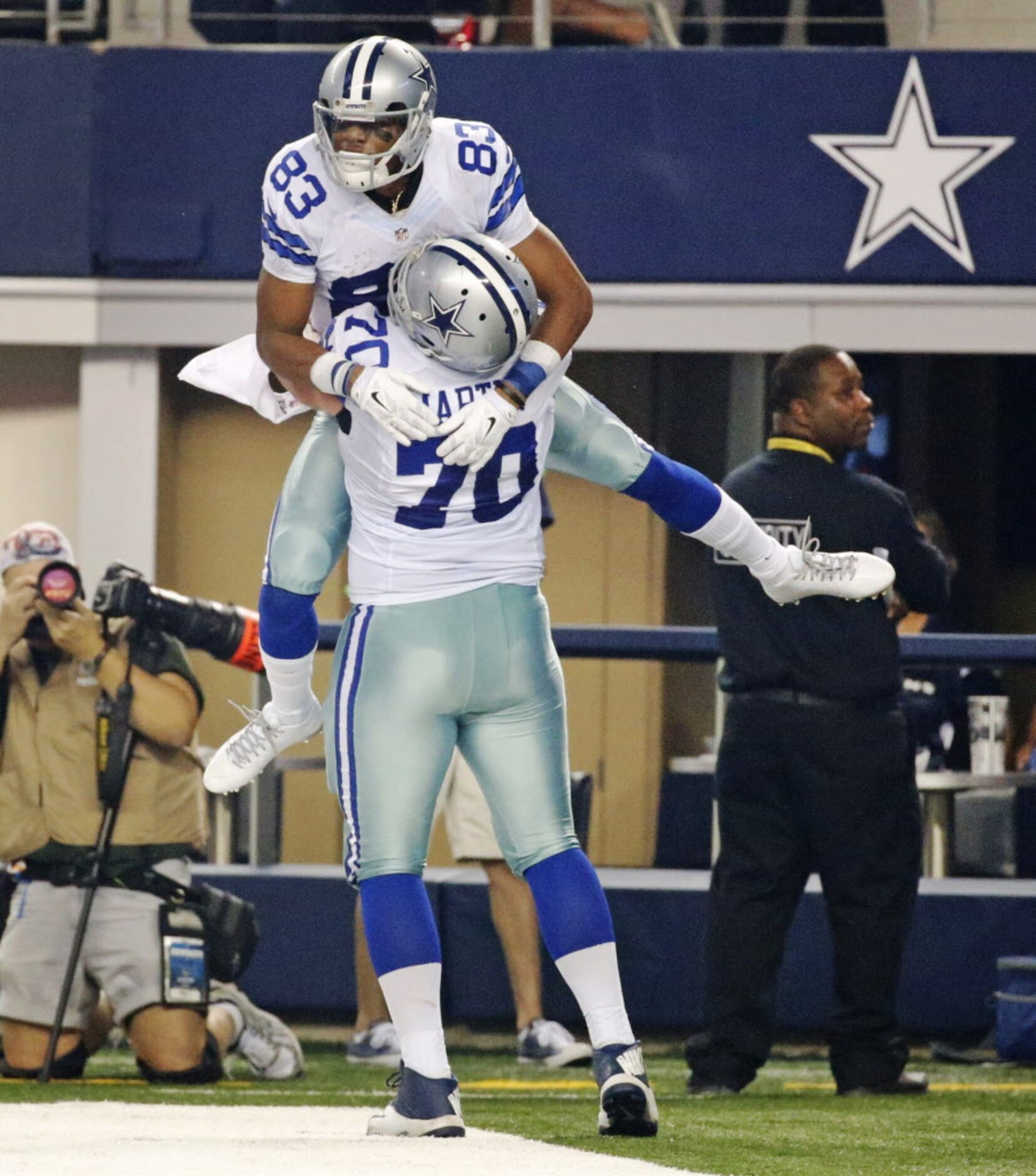 Dallas Cowboys wide receiver Terrance Williams (83) celebrates with guard Zack Martin (70)...