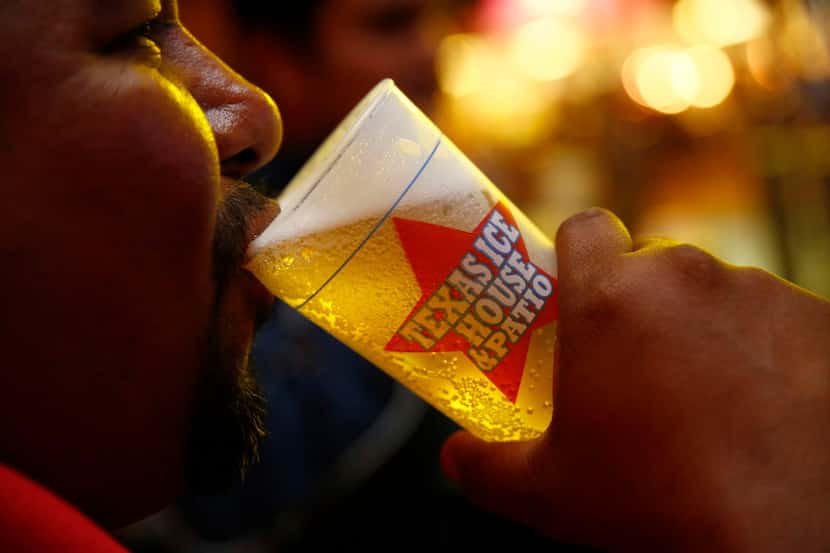 David Guerrero drinks a beer at the Texas Ice House during the State Fair of Texas in Dallas...