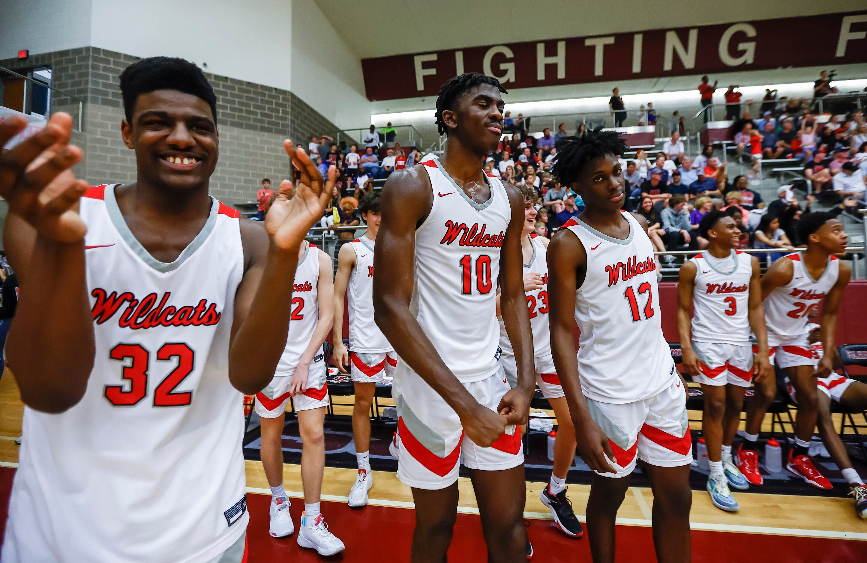 Lake Highlands senior forwards Issaiah Tate (32), Samson Aletan (10) and Jaire Williams (12)...