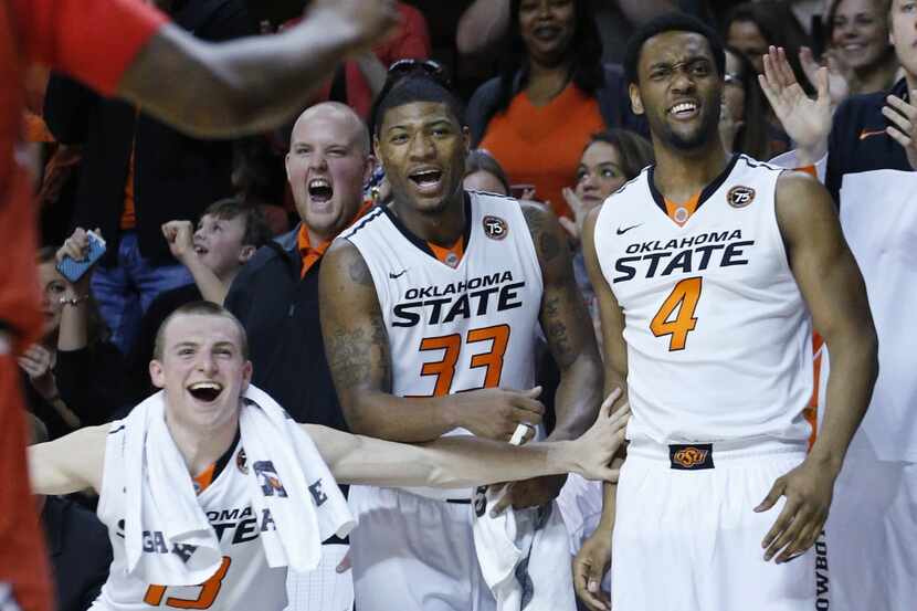 Oklahoma State guard Phil Forte (13), guard Marcus Smart (33) and wing Brian Williams (4)...