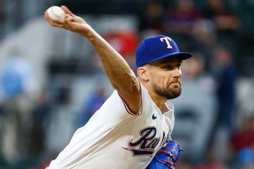 Texas Rangers starting pitcher Nathan Eovaldi (17) throws during the third inning of a...
