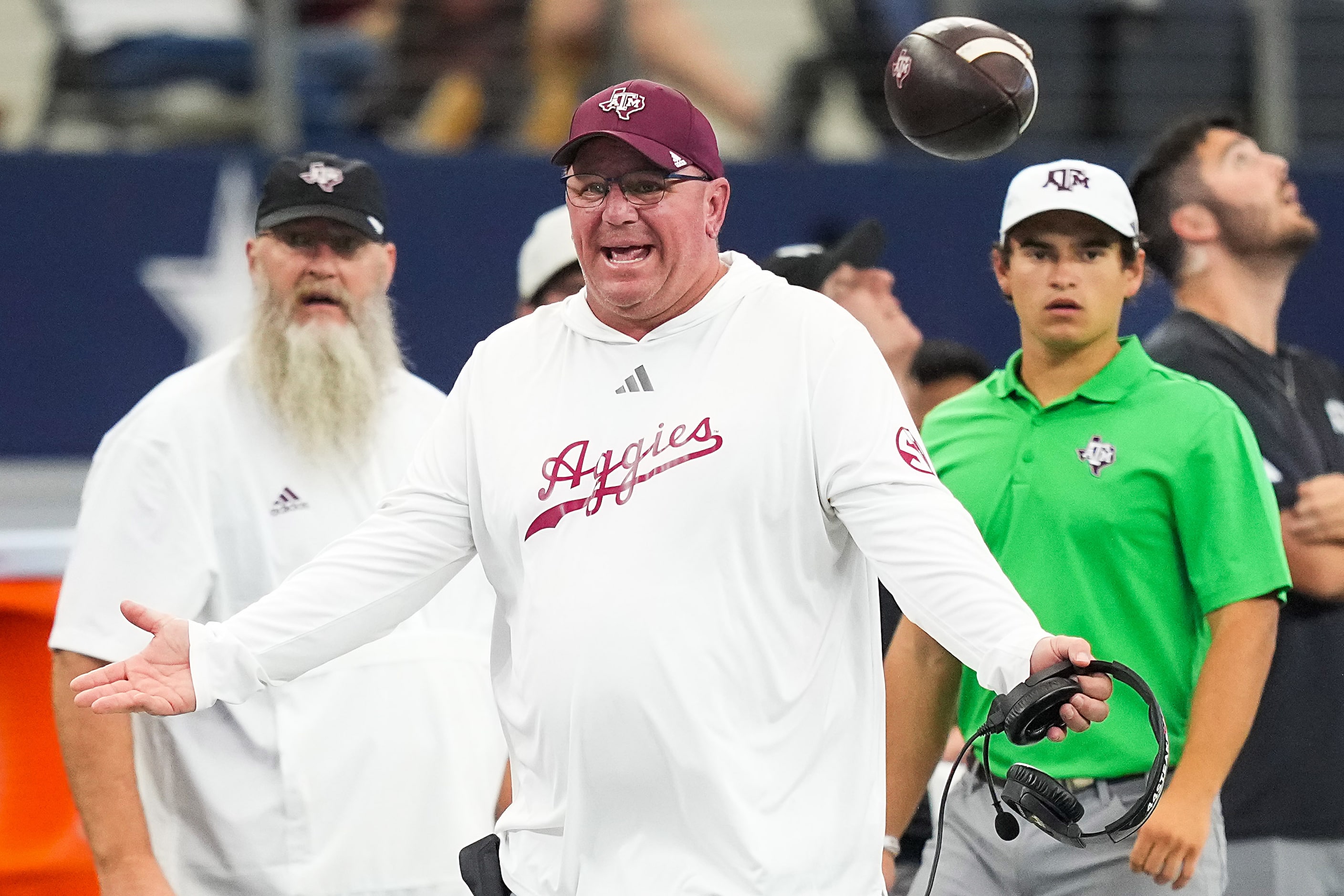 Texas A&M head coach Mike Elko reacts to a call during the first half of an NCAA football...