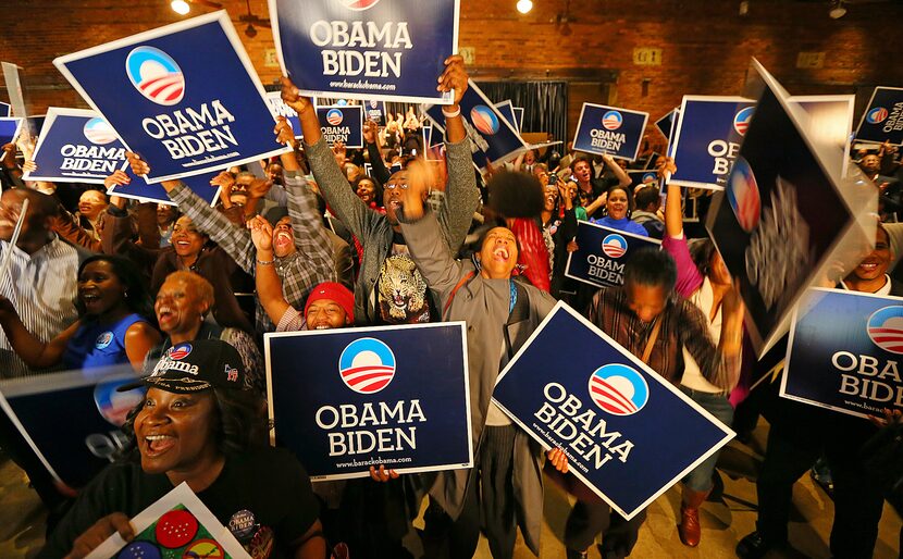 The crowd cheers as President Barack Obama is projected to win re-election against Gov. Mitt...