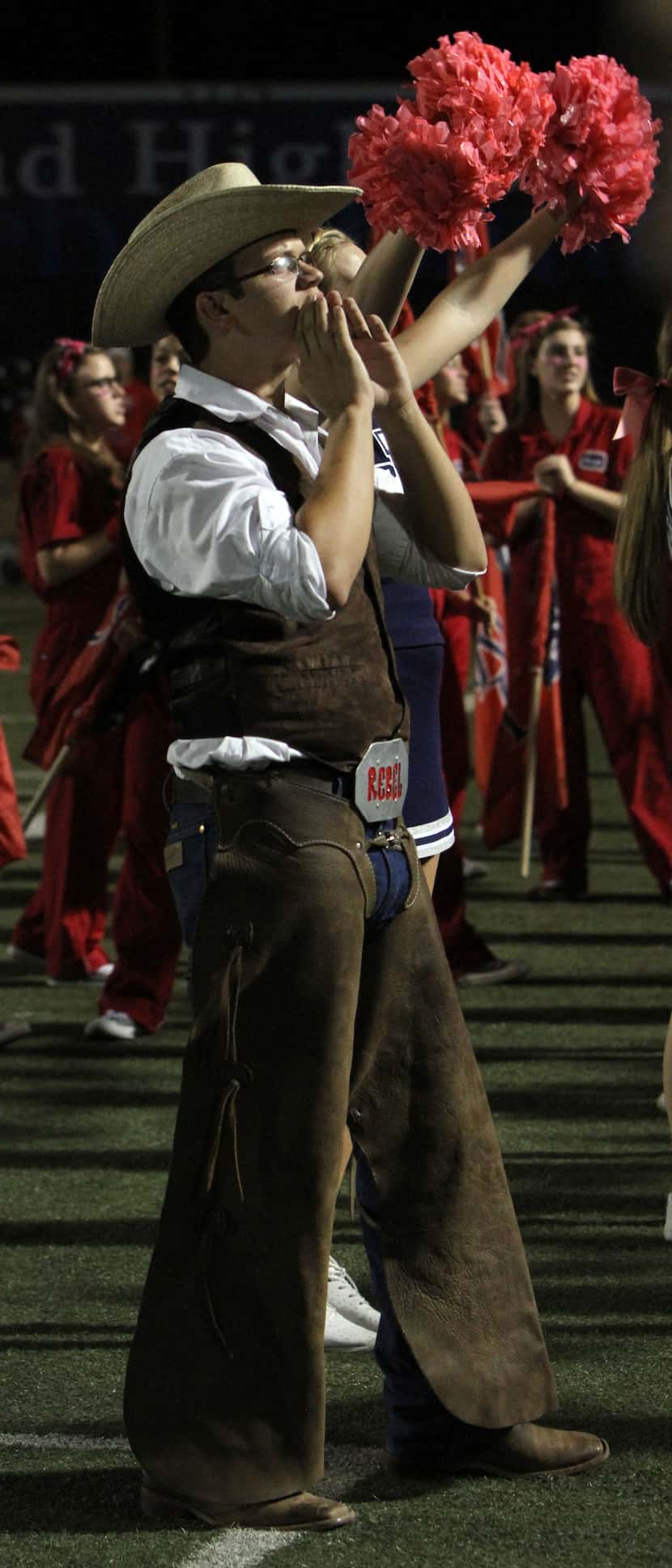 Blake Luczak, a junior at Richland High School, dressed as Rebel Man before a game at...