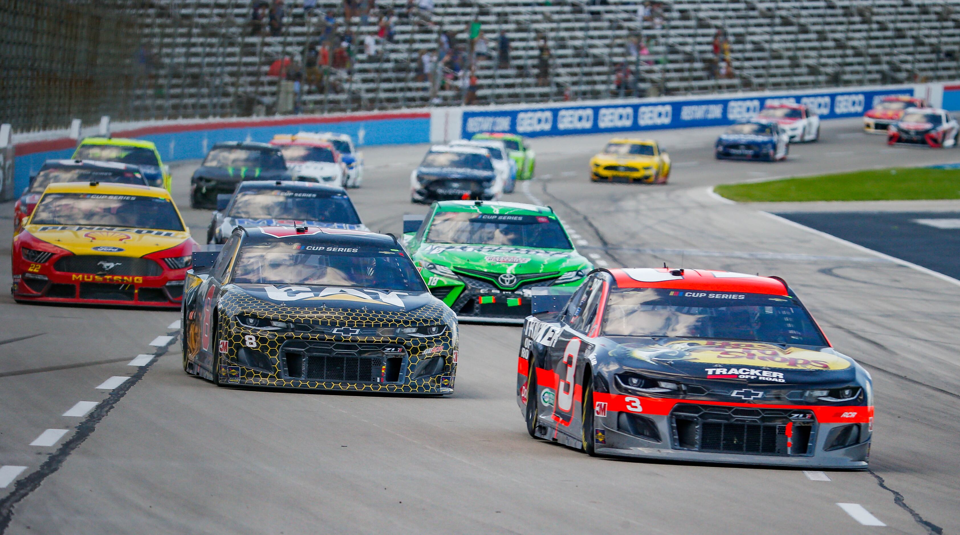 Driver Austin Dillon (No. 3) leads after crossing the finish line during the NASCAR Cup...