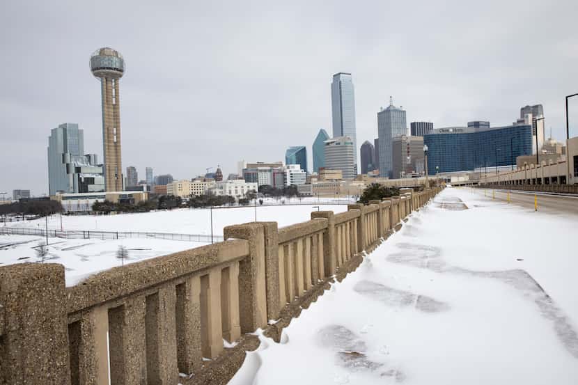 A snow-covered Downtown Dallas seen from S. Houston St. on Monday, Feb. 15, 2021. (Juan...