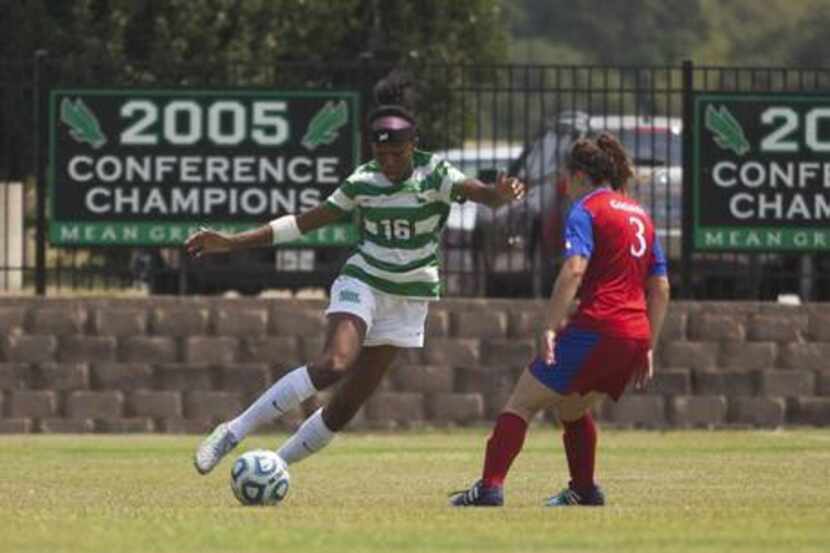 North Texas forward Rachel Holden tries to get by a Kansas defender in a 2-1 loss on Sunday...