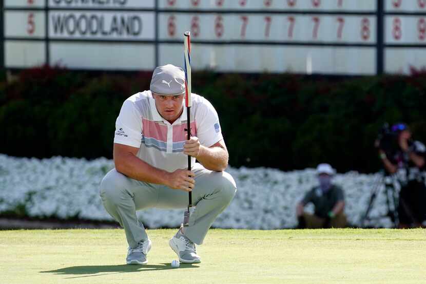PGA Tour golfer Bryson DeChambeau lines up his birdie attempt on No. 18 during the second...