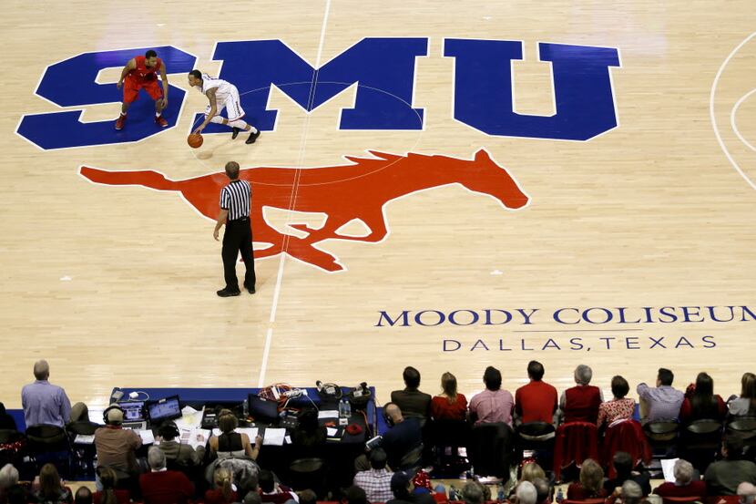 SMU guard Nick Russell (12) defends against Shabazz Napier (13) during SMU vs. Connecticut...
