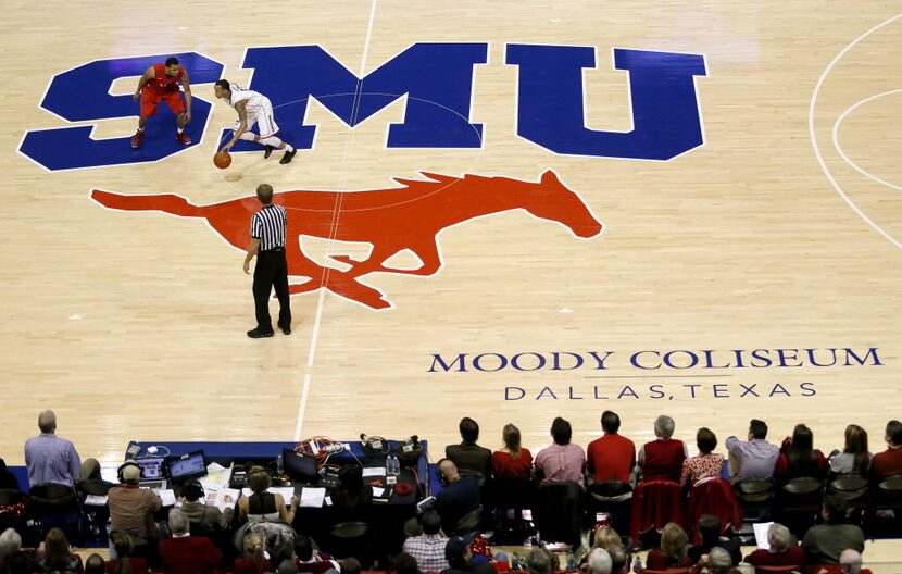 SMU guard Nick Russell (12) defends against Shabazz Napier (13) during SMU vs. Connecticut...