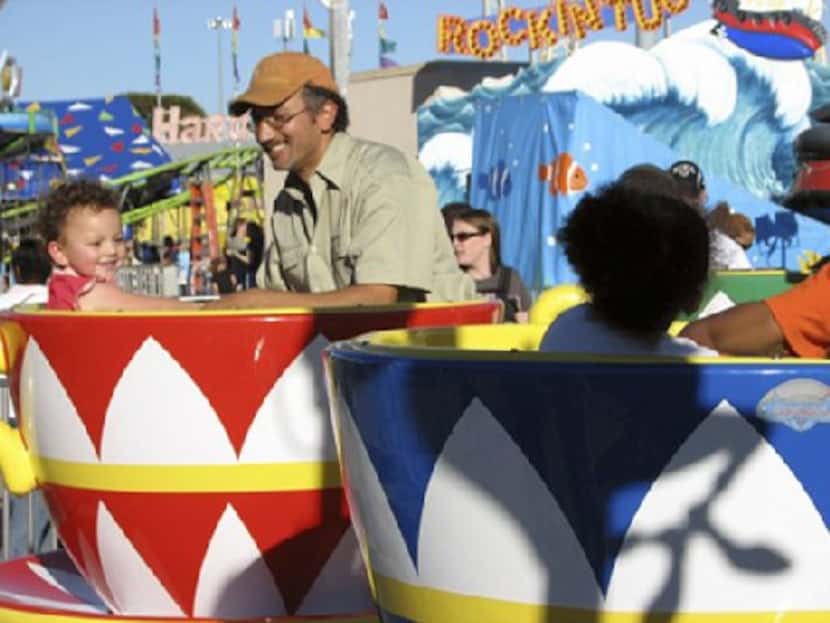 Dallas Morning News metro columnist James Ragland enjoys a ride at the State Fair of Texas...
