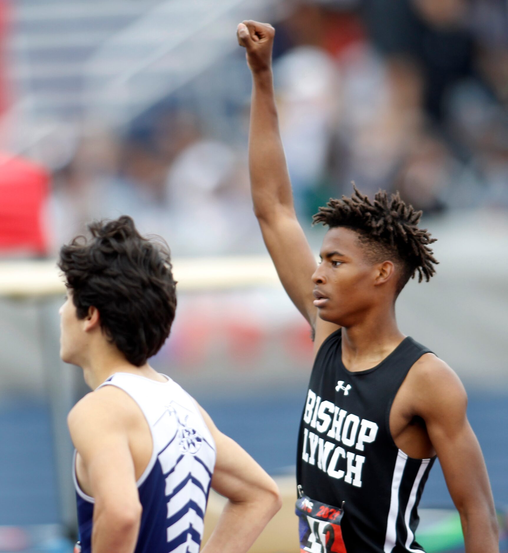 Bishop Lynch hurdler Jeremiah Williams reacts to fan reaction after he was announced as the...