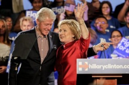  Former President Bill Clinton hugs his wife, Hillary Clinton, after she won the Nevada...