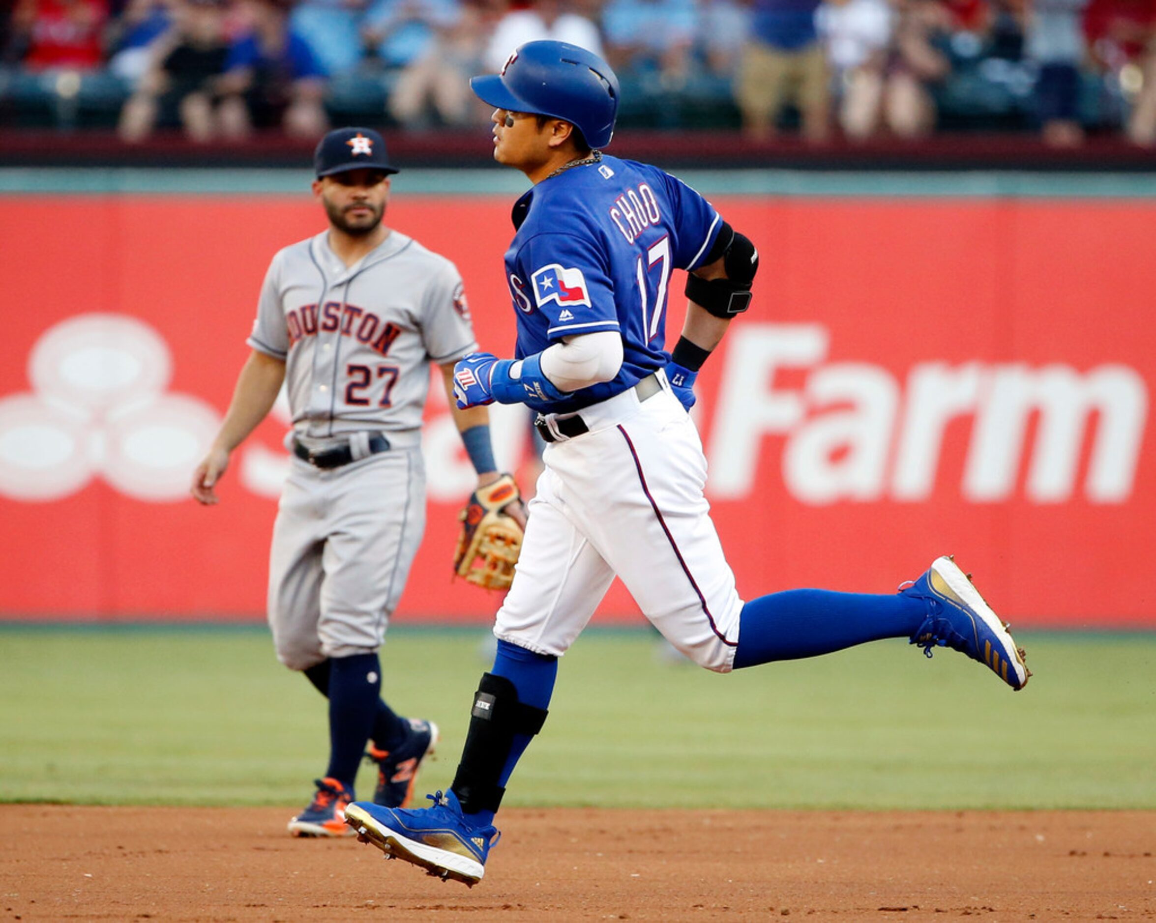 Texas Rangers batter Shin-Soo Choo (17) rounds the bases after hitting a lead off home run...