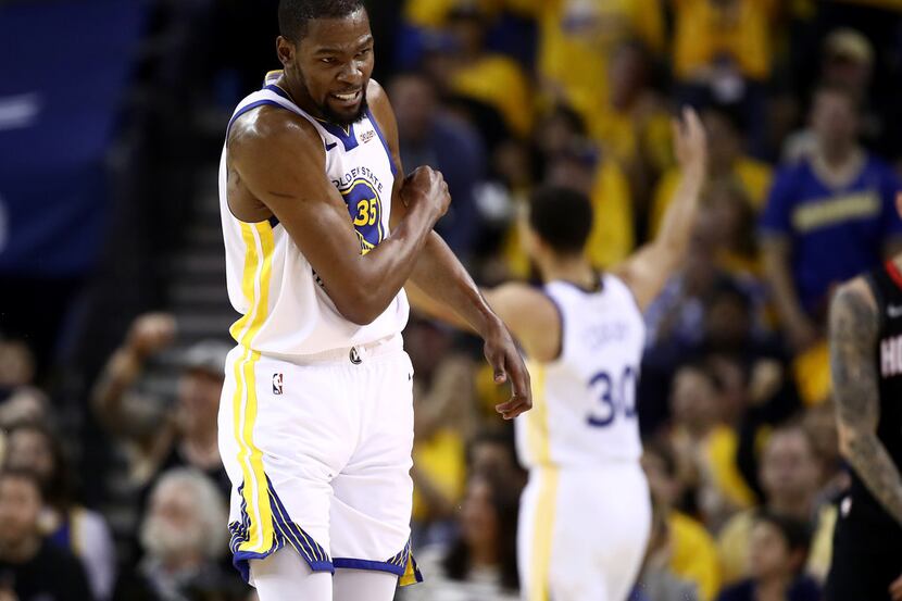 OAKLAND, CALIF. - MAY 08:   Kevin Durant (35) of the Golden State Warriors reacts after they...