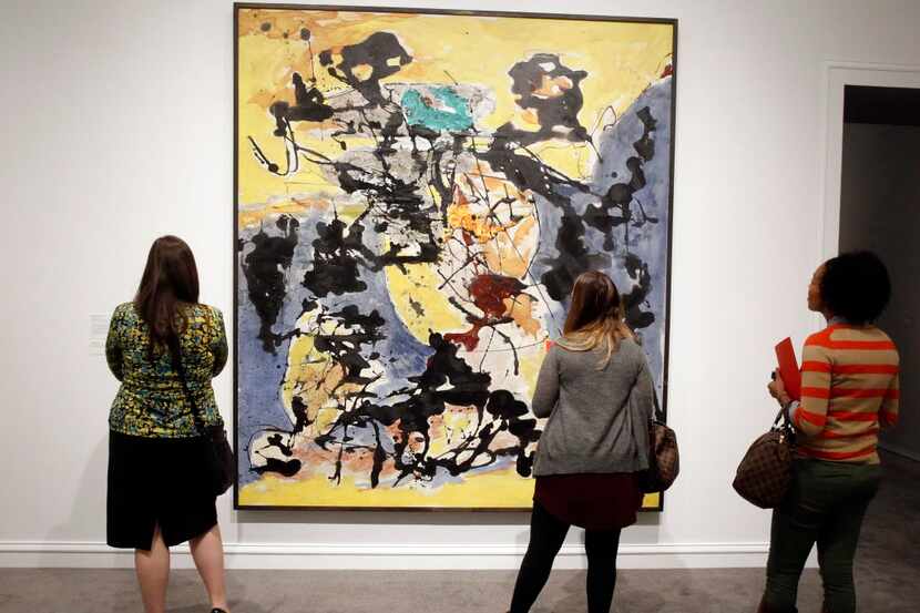  Guest to the Dallas Museum of Art gaze at Jackson Pollock's Number 12, 1952, which is part...