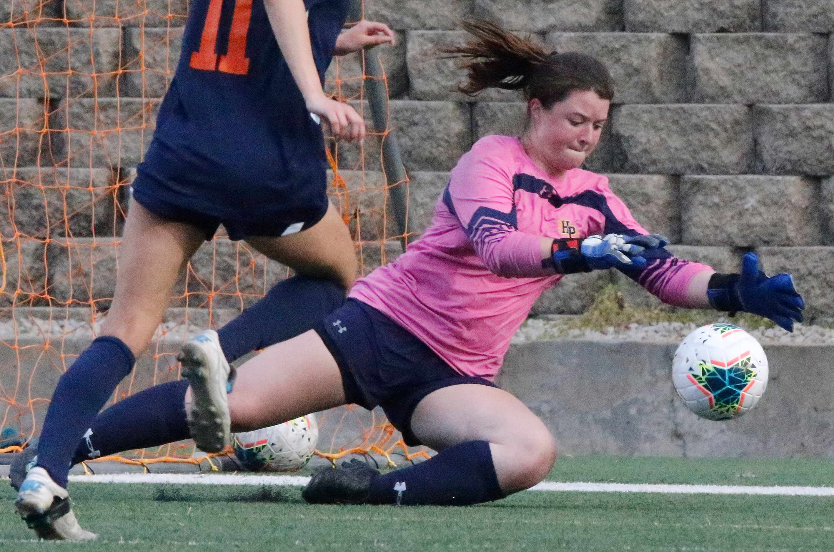 Highland Park goalkeeper Claire Binns (1) covers the soccer ball during the first half as...