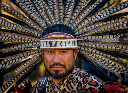 Jose Guzman, of Tyler, Texas, a member of Danza Guerreros Chichimecas Tonantzin, waits to...